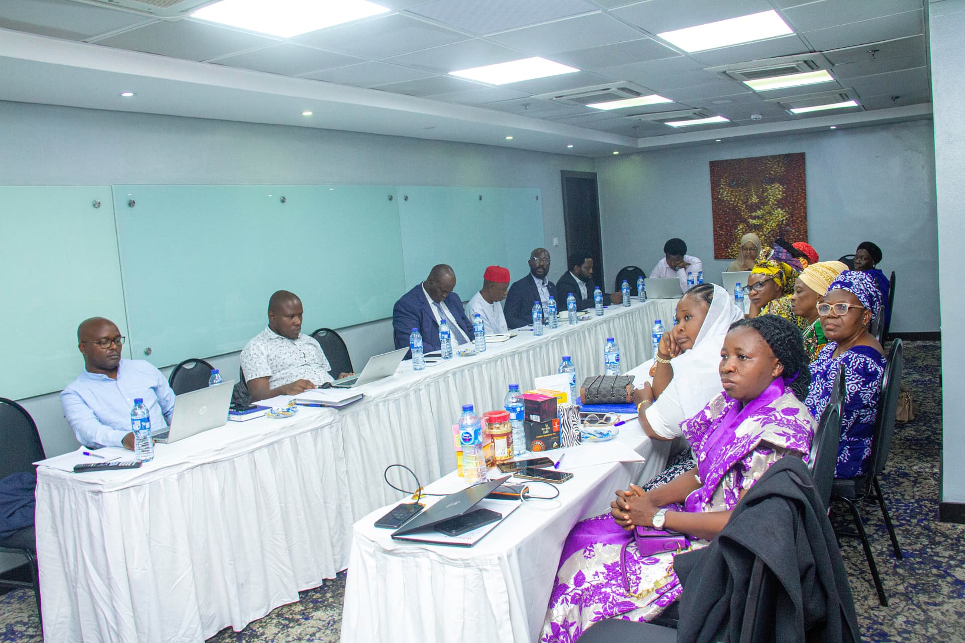 Delegates seated around the boardroom table during the dialogue session